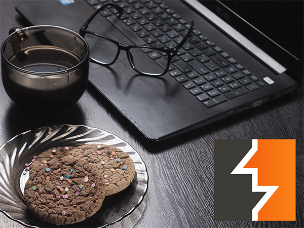A plate of cookies resting near a laptop with the Burp Suite logo in the corner.